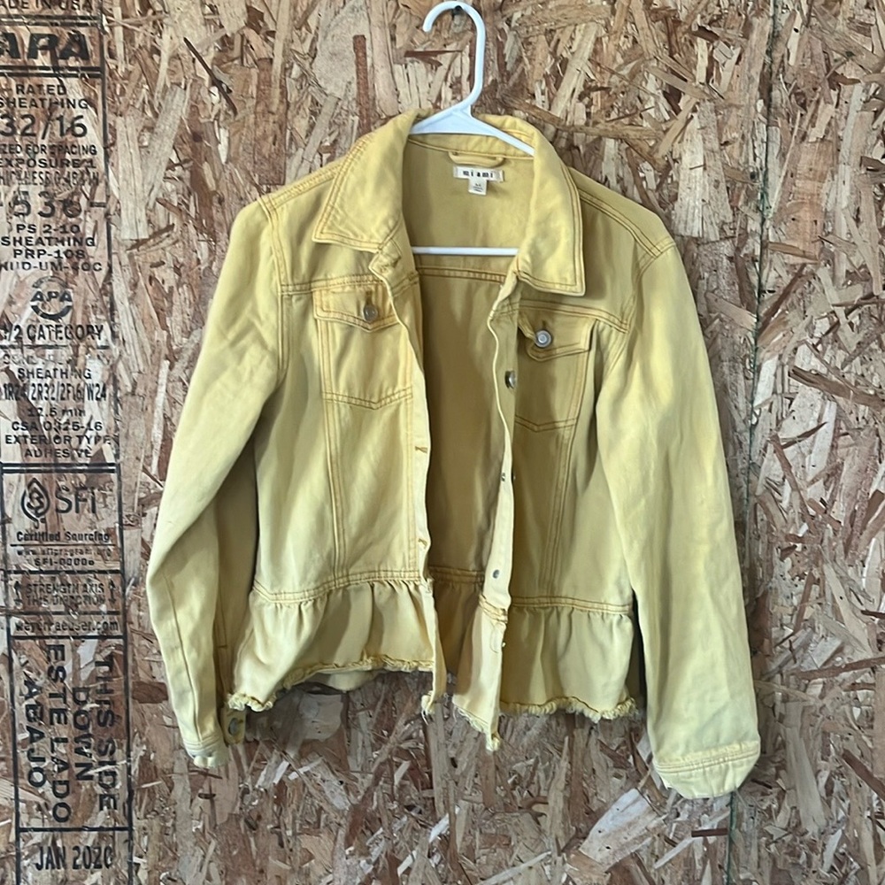 Woman’s yellow jacket
